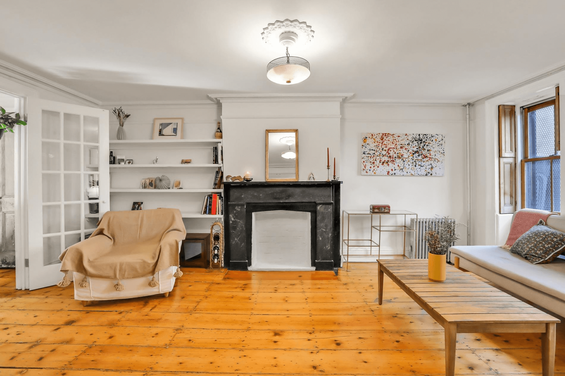 living room with a black marble mantel