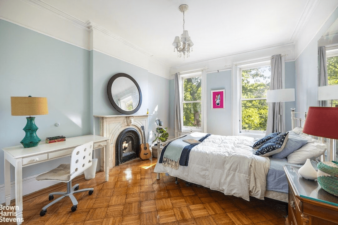 bedroom with picture rails and marble mantel