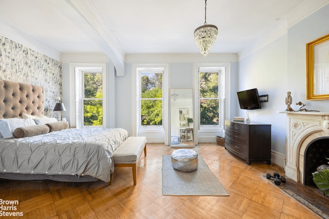 bedroom with picture rail, bed niche and marble mantel