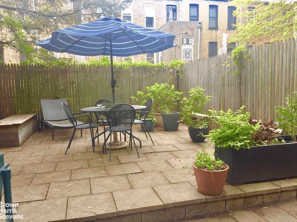 garden with raised stone patio