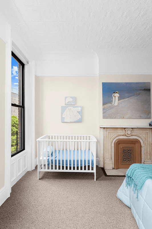 bedroom with carpet and mantel