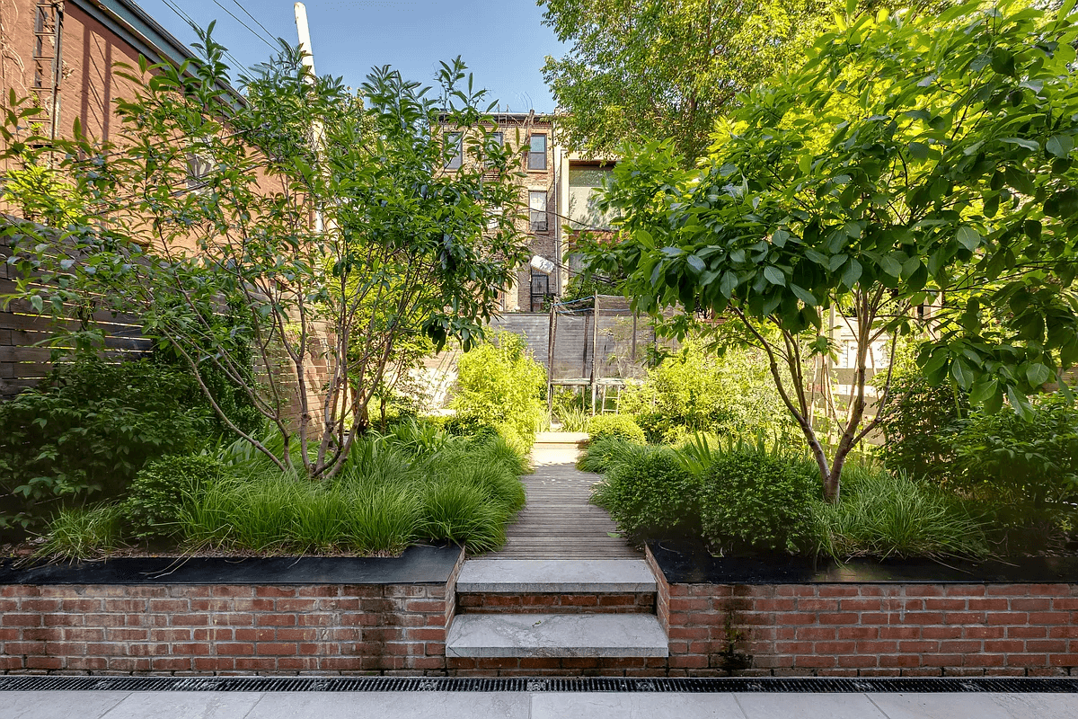 garden with planted beds and wood decking