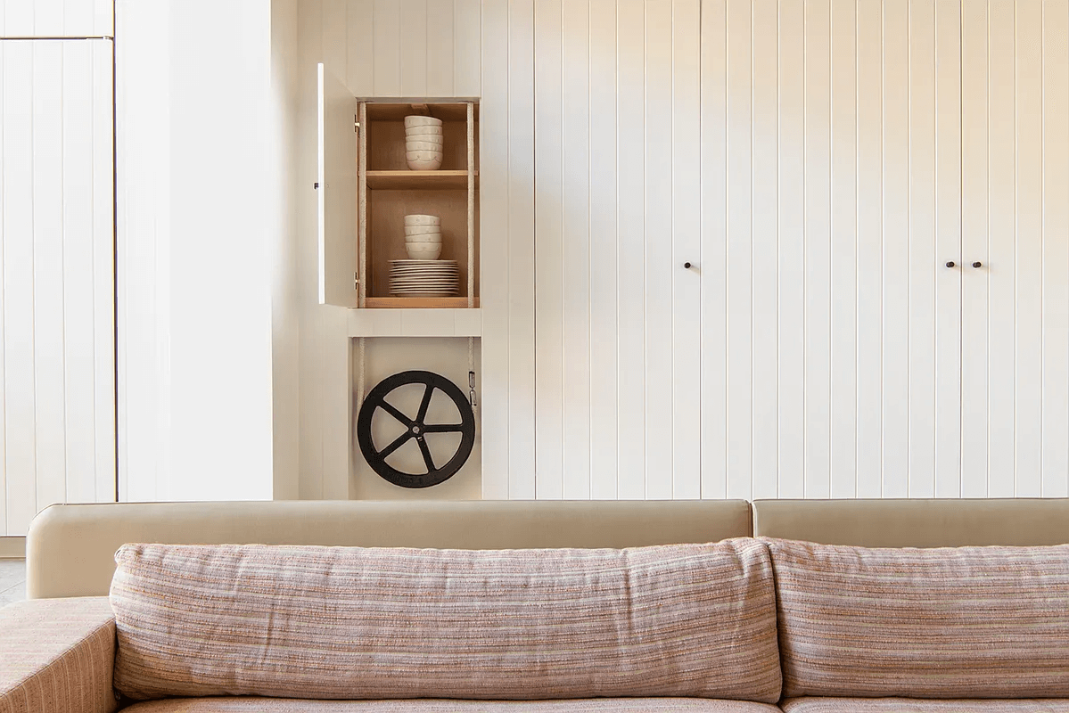 wall of hidden storage in kitchen