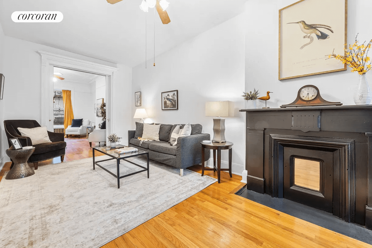 parlor with coats and wood floors