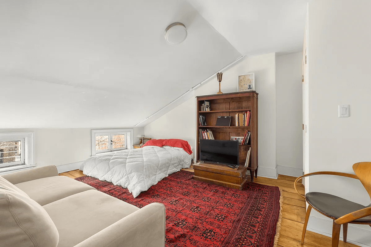 top floor bedroom with angled ceiling