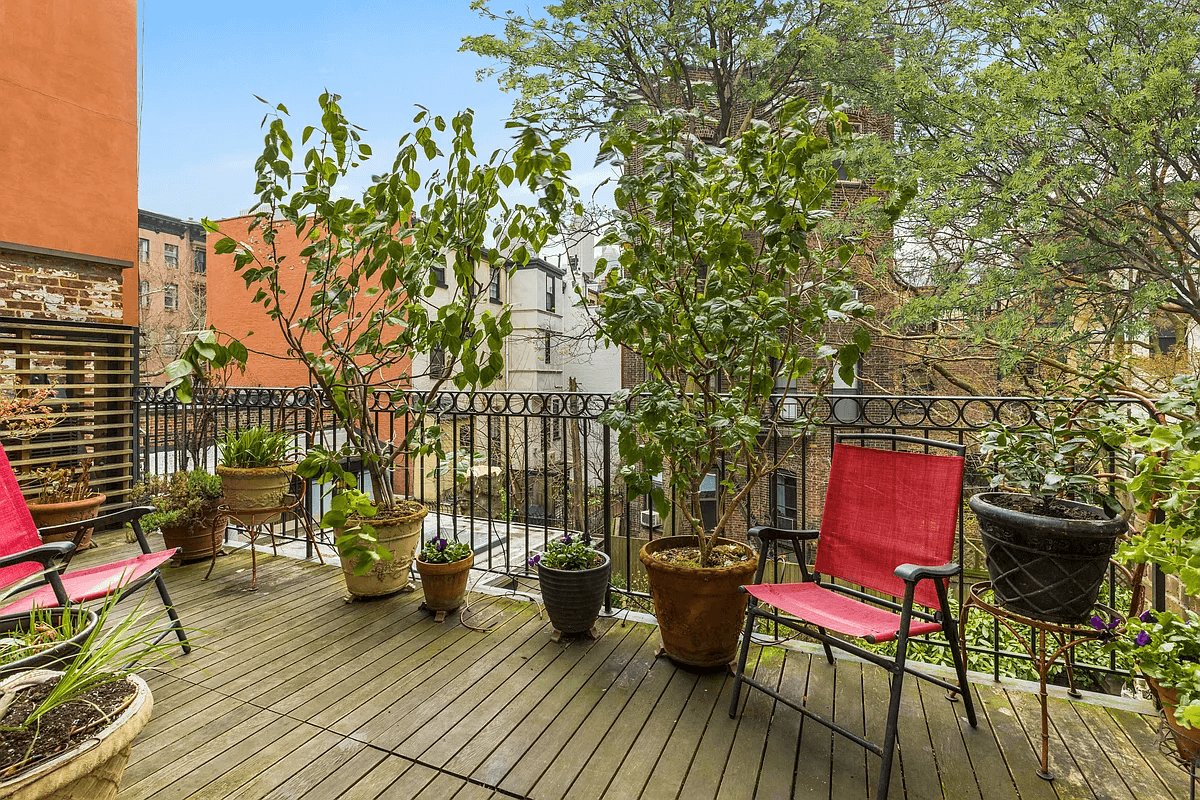 deck with planters and chairs