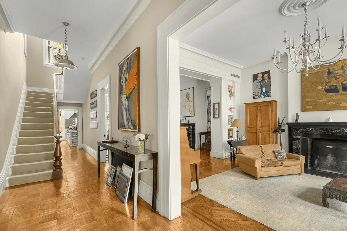 hallway with view of stair with original newel post