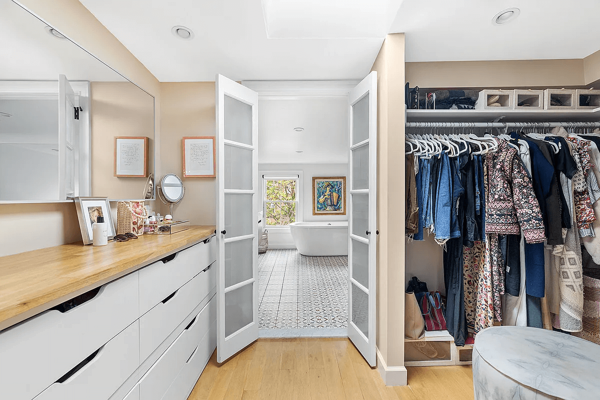 walk-in closet with view to bathroom