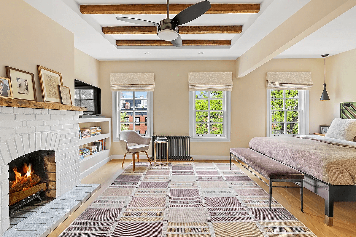 bedroom with brick fireplace