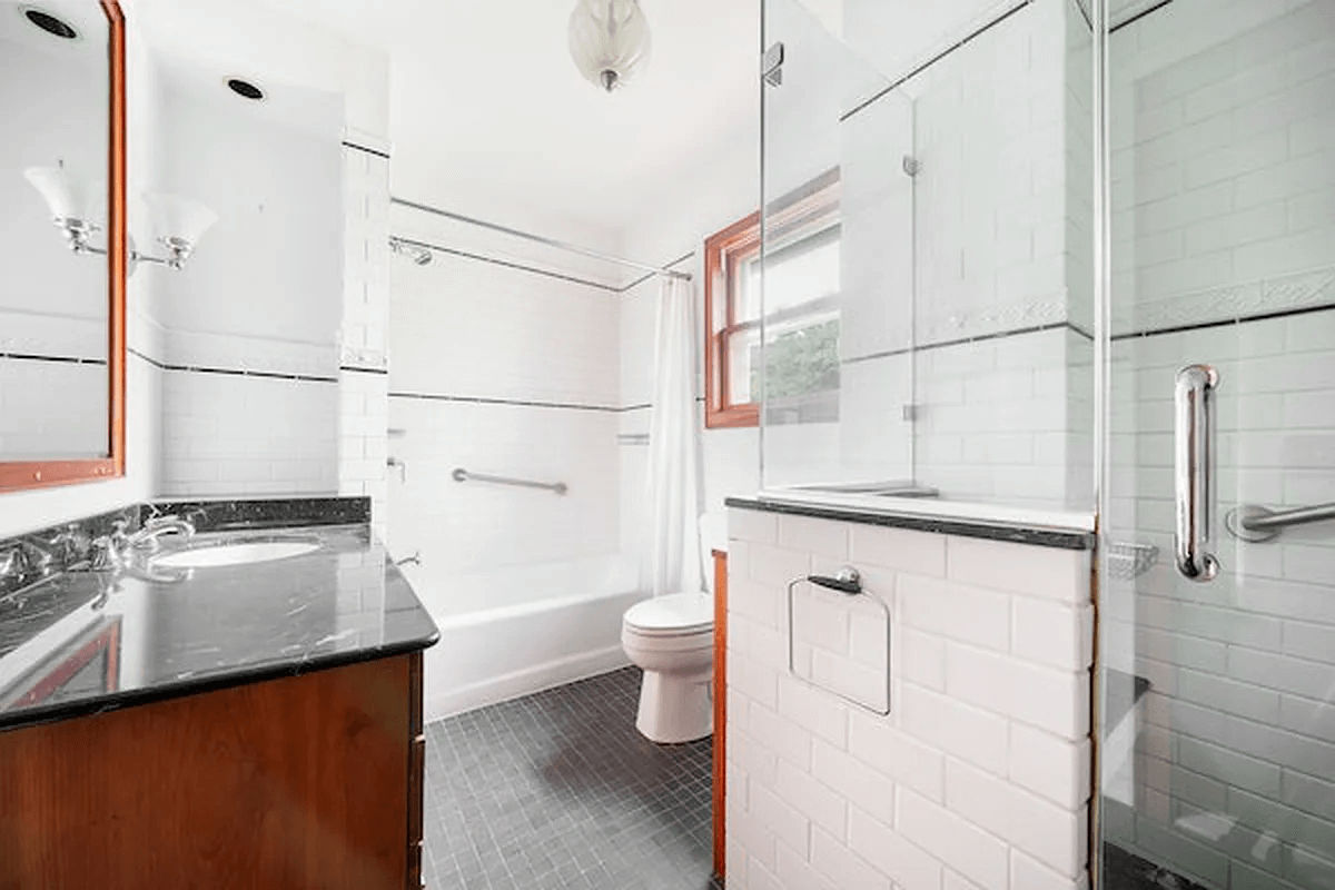 bathroom with wood vanity