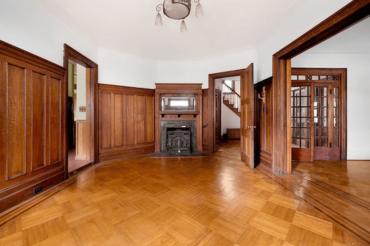 dining room with wainscoting and mantel