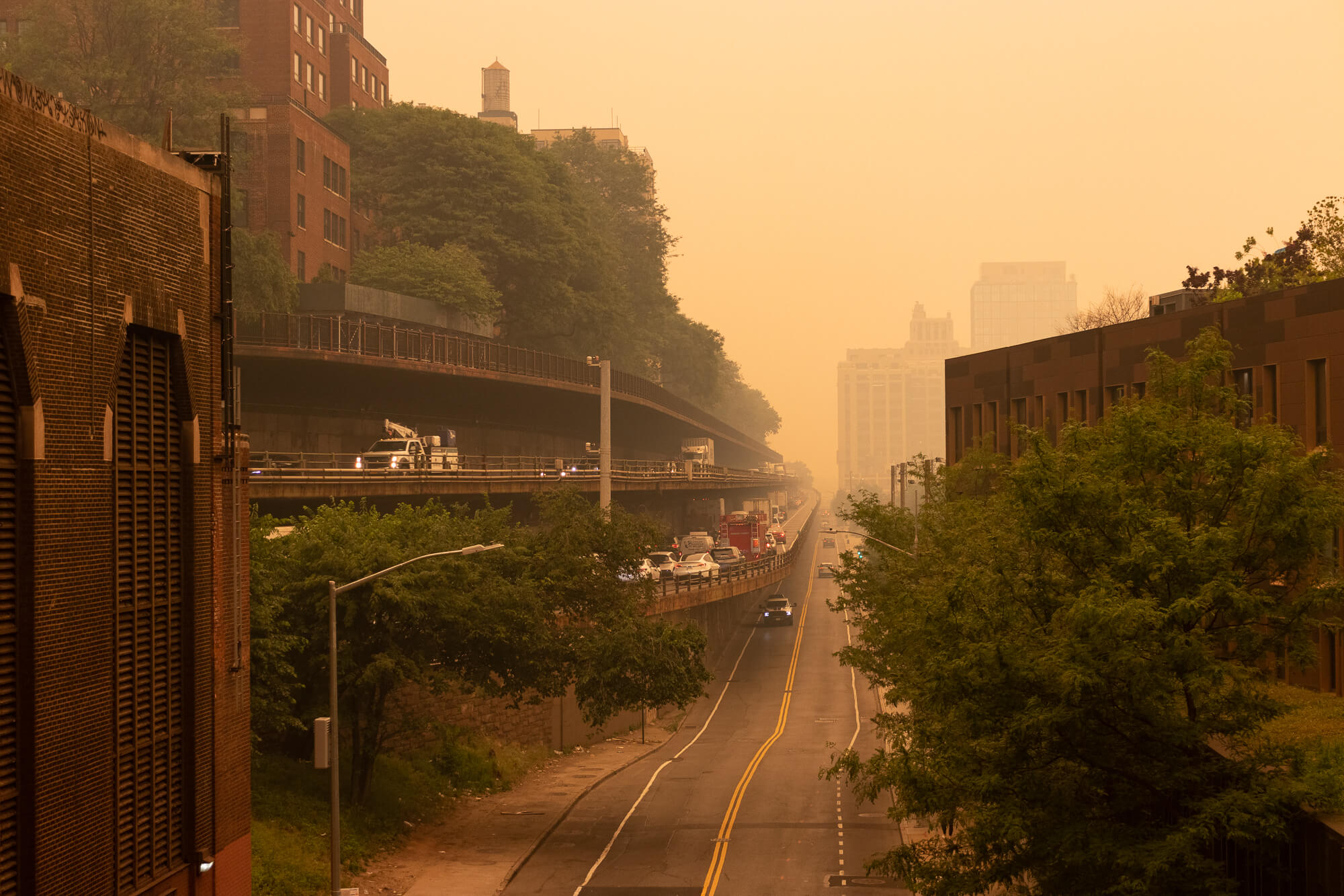 cars driving through haze on the bqe