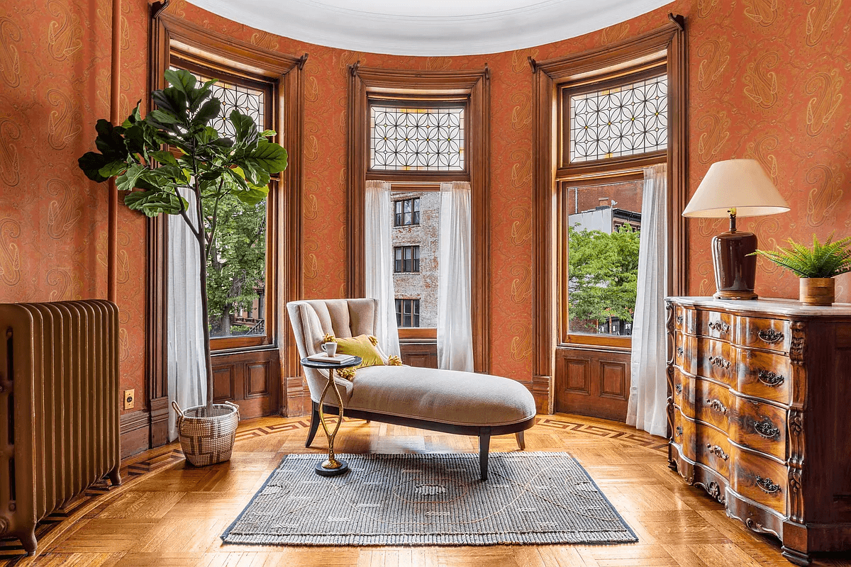 bedroom with seating area in bay window