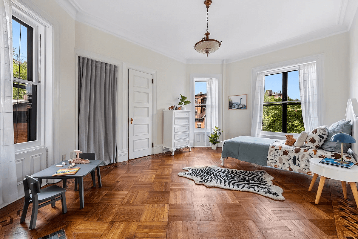 bedroom with two exposures and wood floor