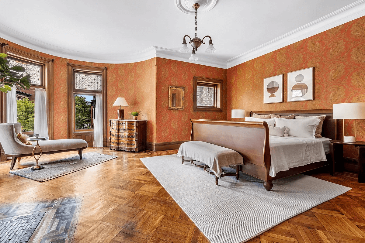 bedroom with wood floor and paisley wallpaper