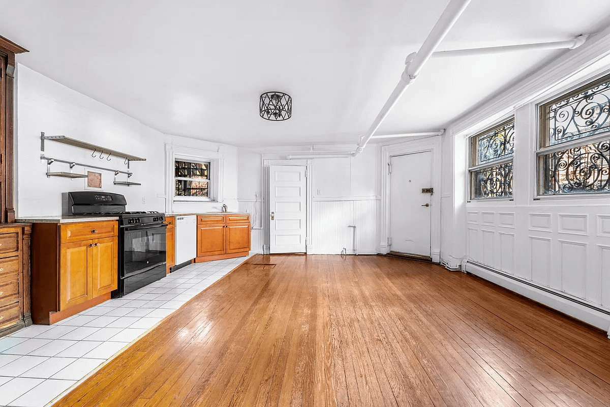 open plan garden level with tiled kitchen area