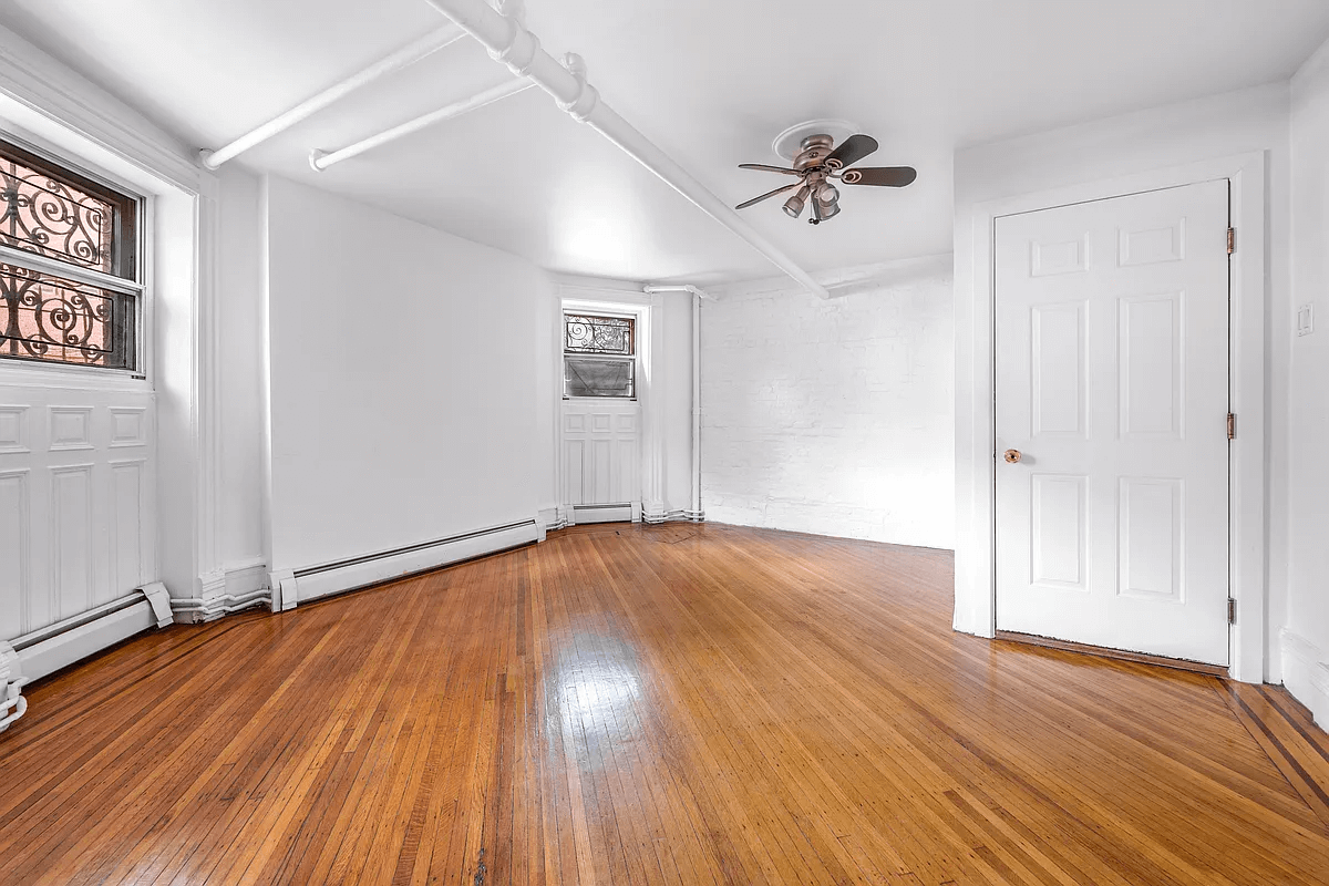 garden level with wood floors and baseboard heating