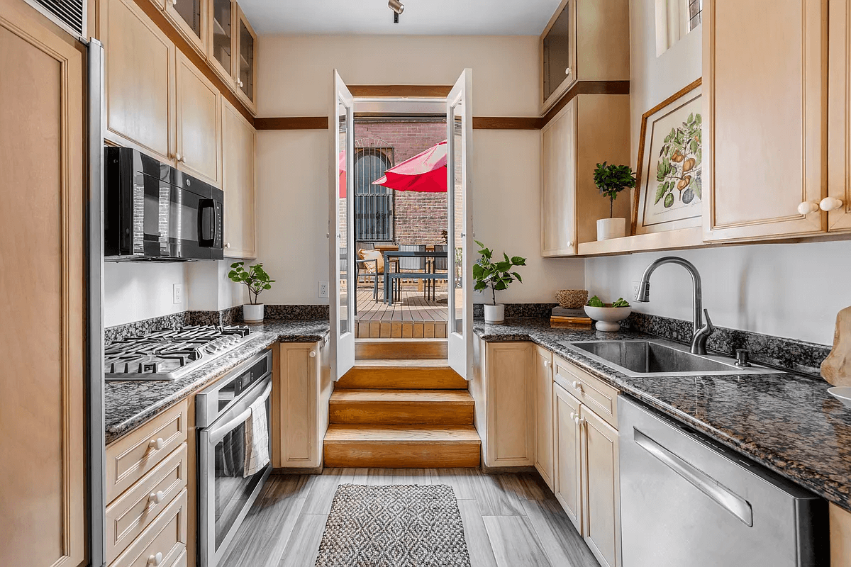 kitchen with steps up to a deck