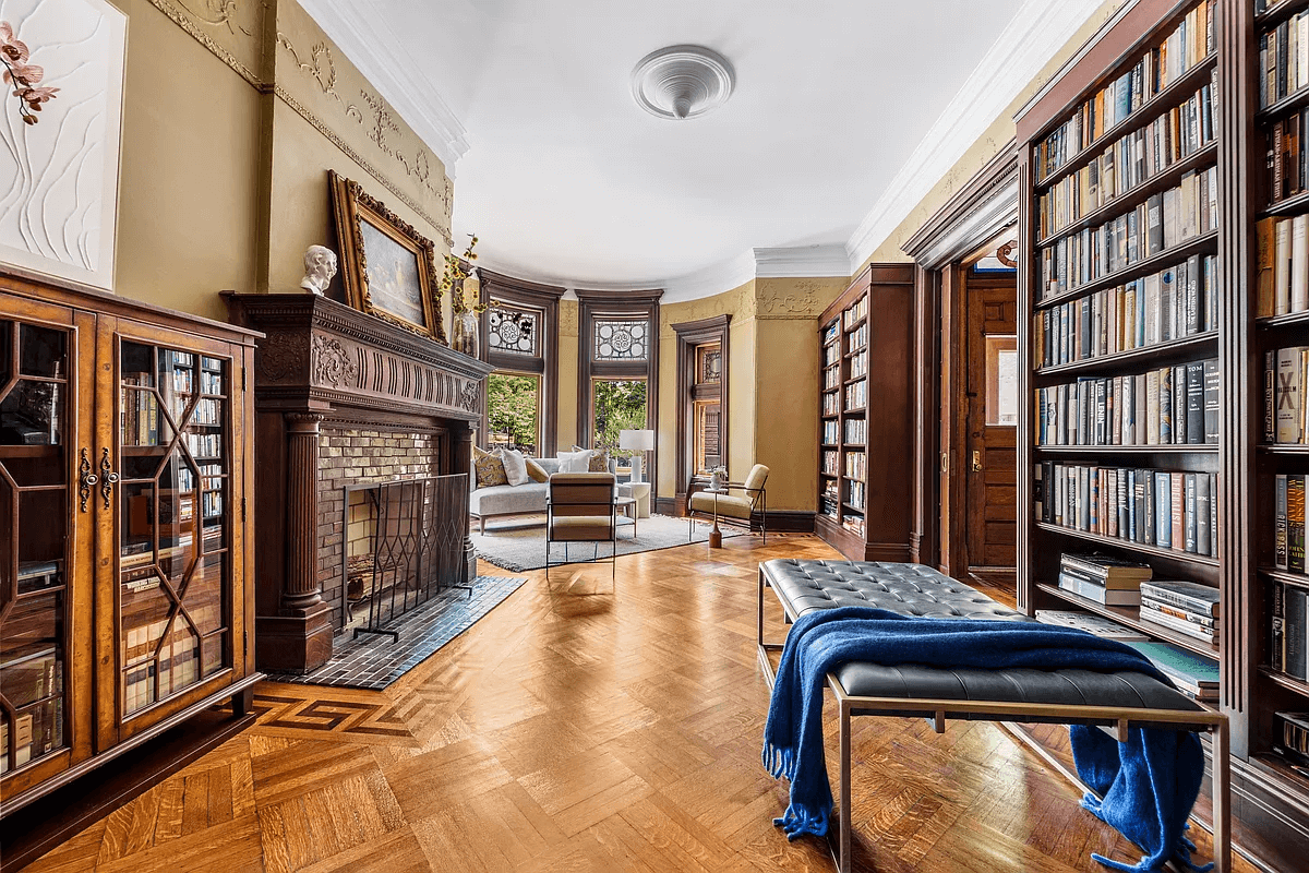 parlor with mantel and bay window