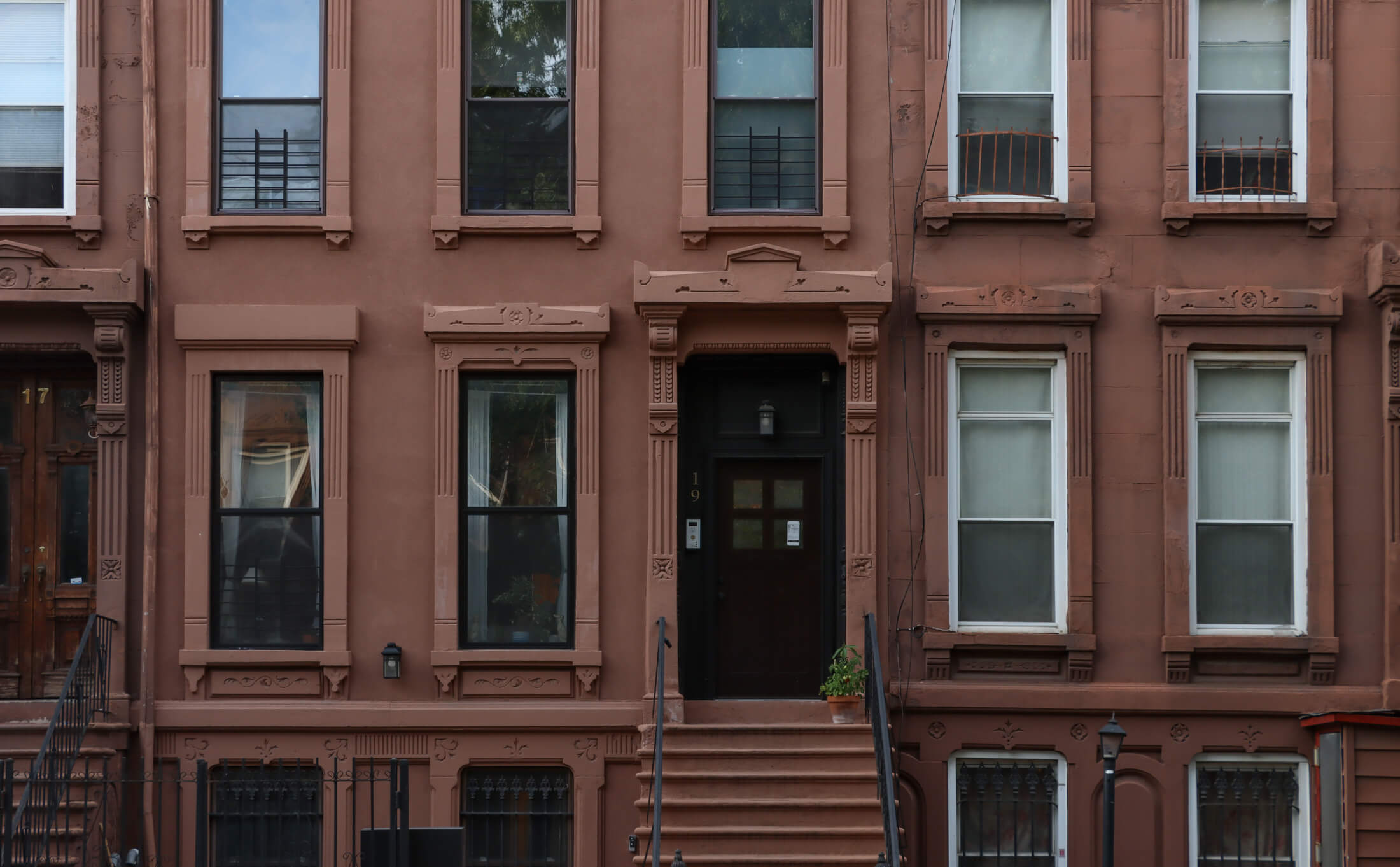 a brownstone stoop on hart street