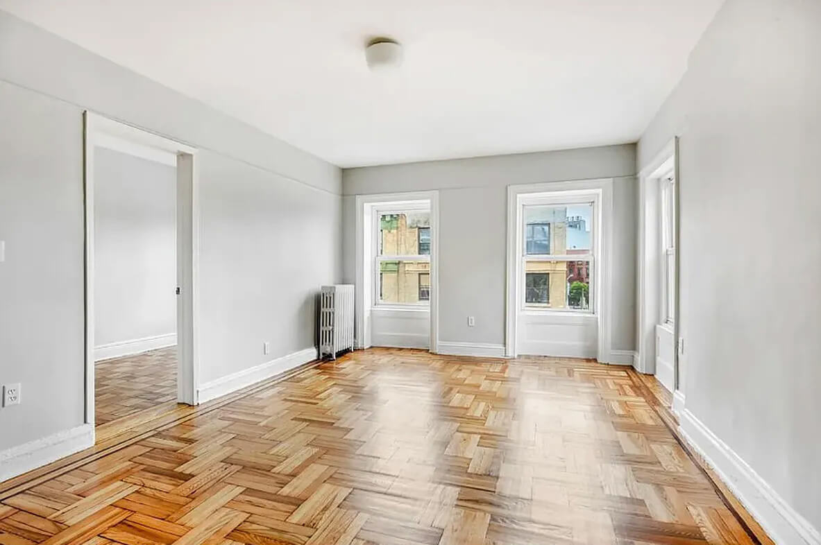 living room with two windows and wood floor