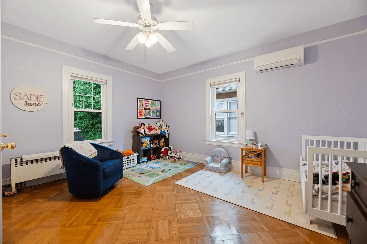 bedroom with purple walls and a ceiling fan