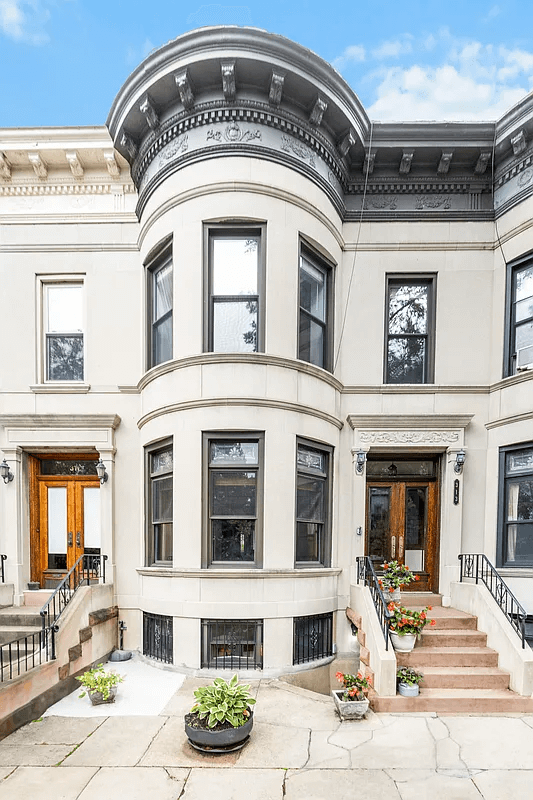 exterior of bow front limestone house