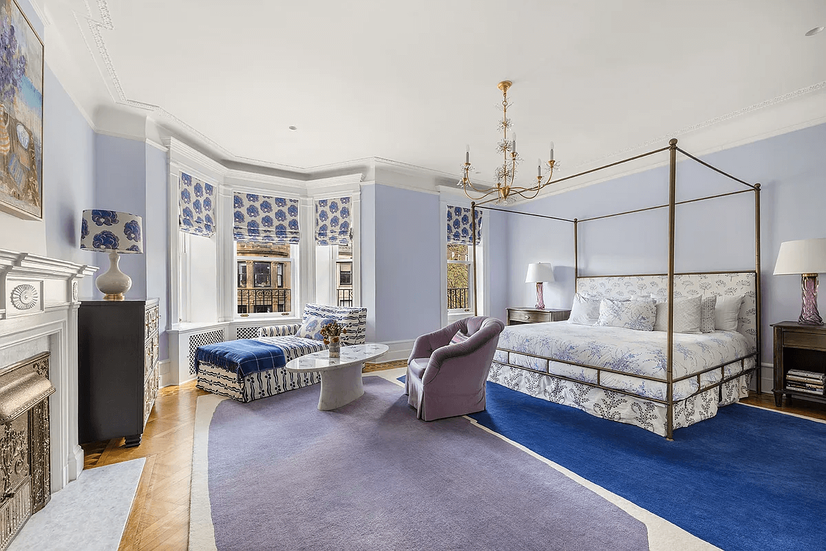 third floor bedroom with bay window and mantel