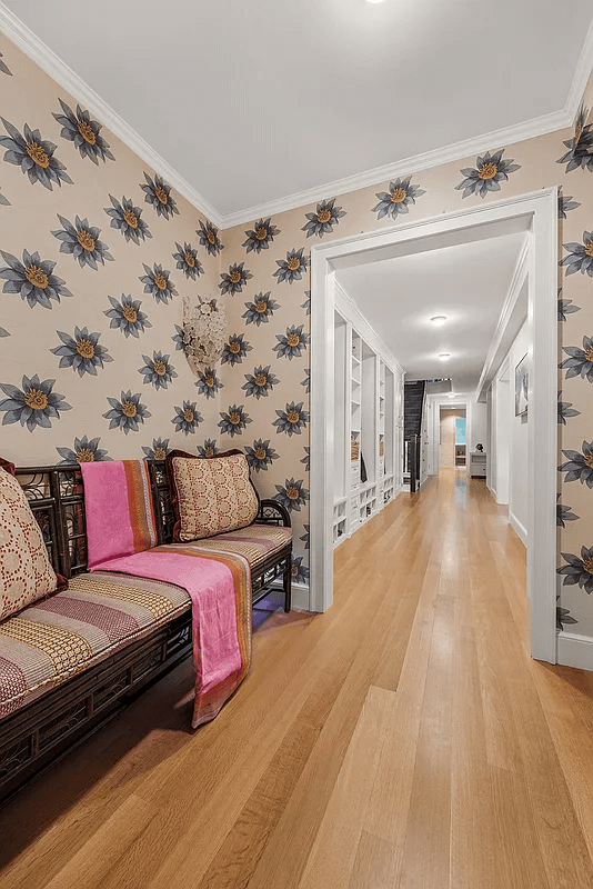 garden level hallway with overscaled floral wallpaper