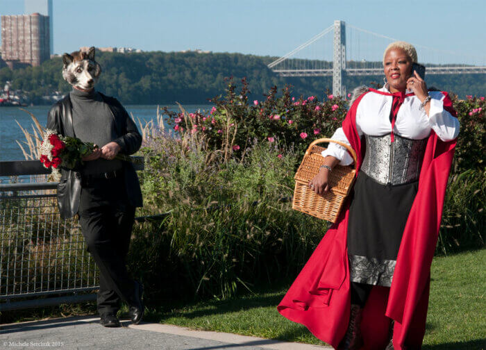 artist dressed as red riding hood