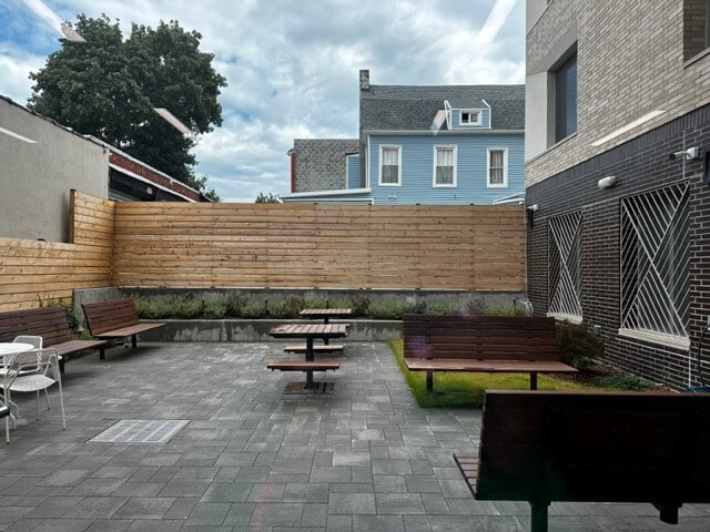 paved yard with benches