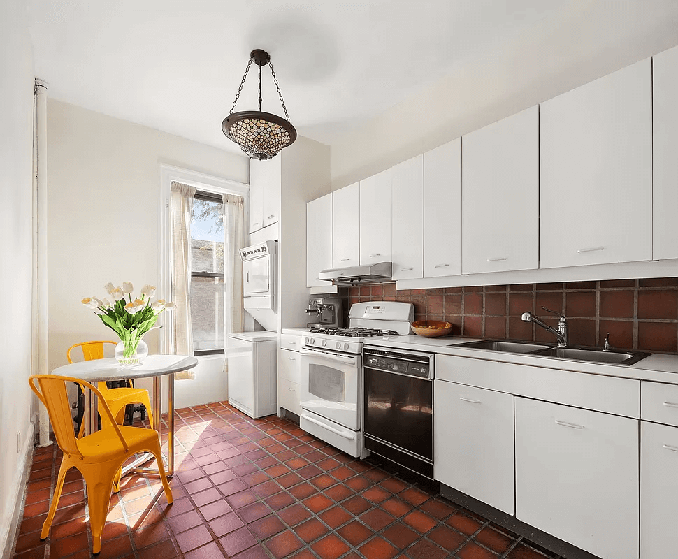 kitchen with tile floor and white cabinets