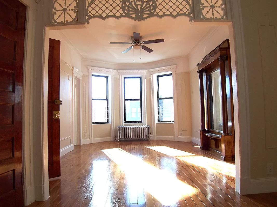 living rom with pier mirror, wall moldings, picture rail and fretwork