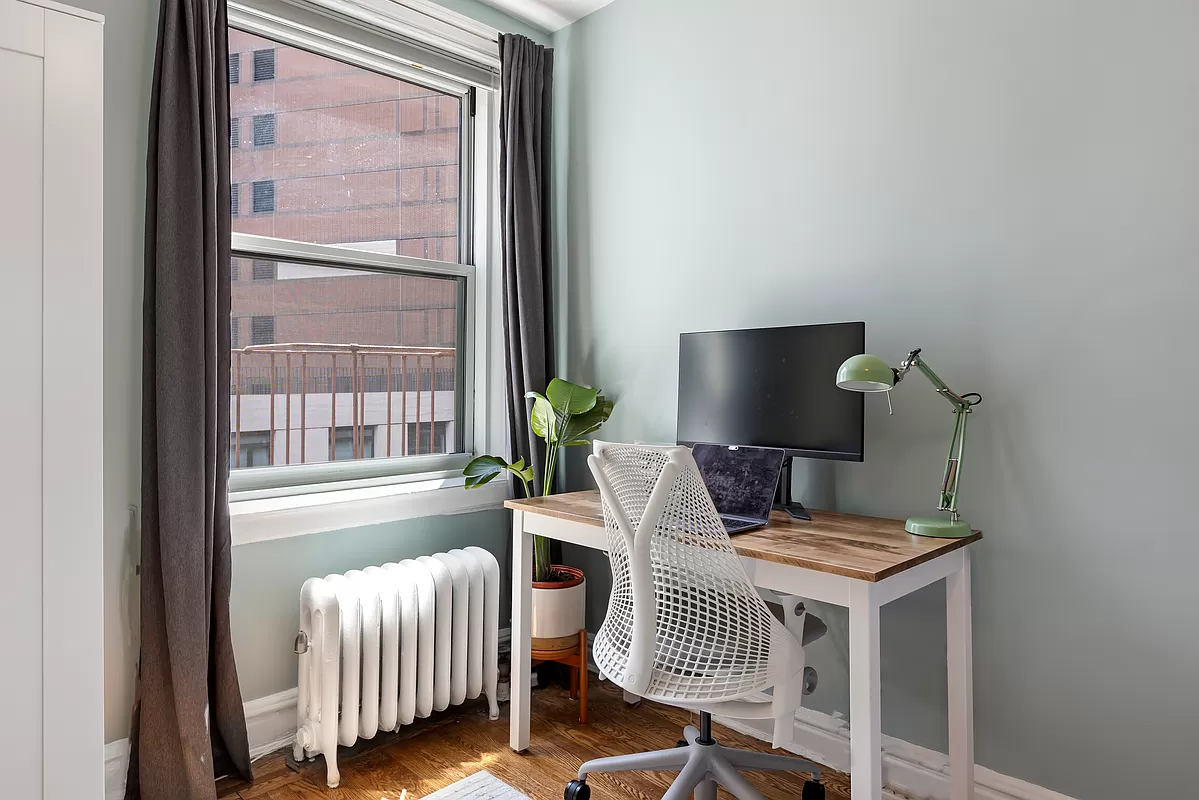 desk set near a window in the bedroom