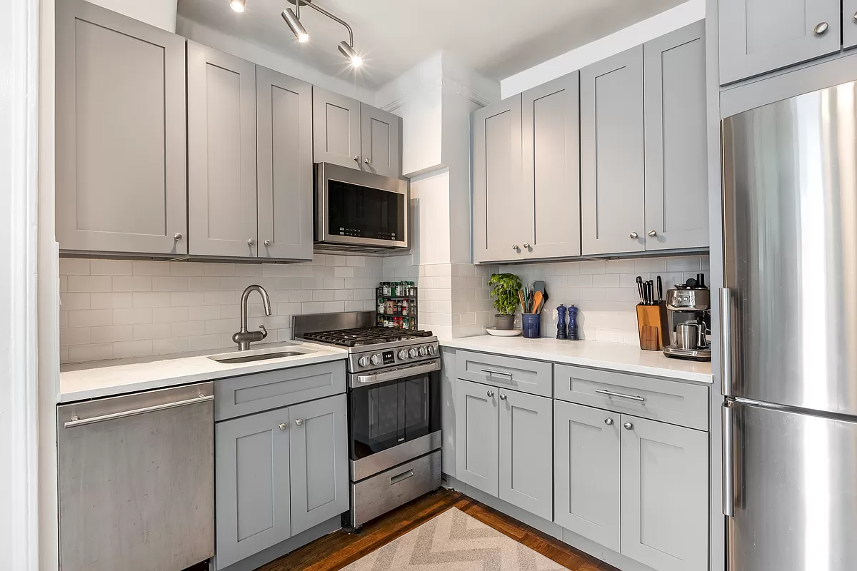 kitchen with gray cabinets and a dishwasher