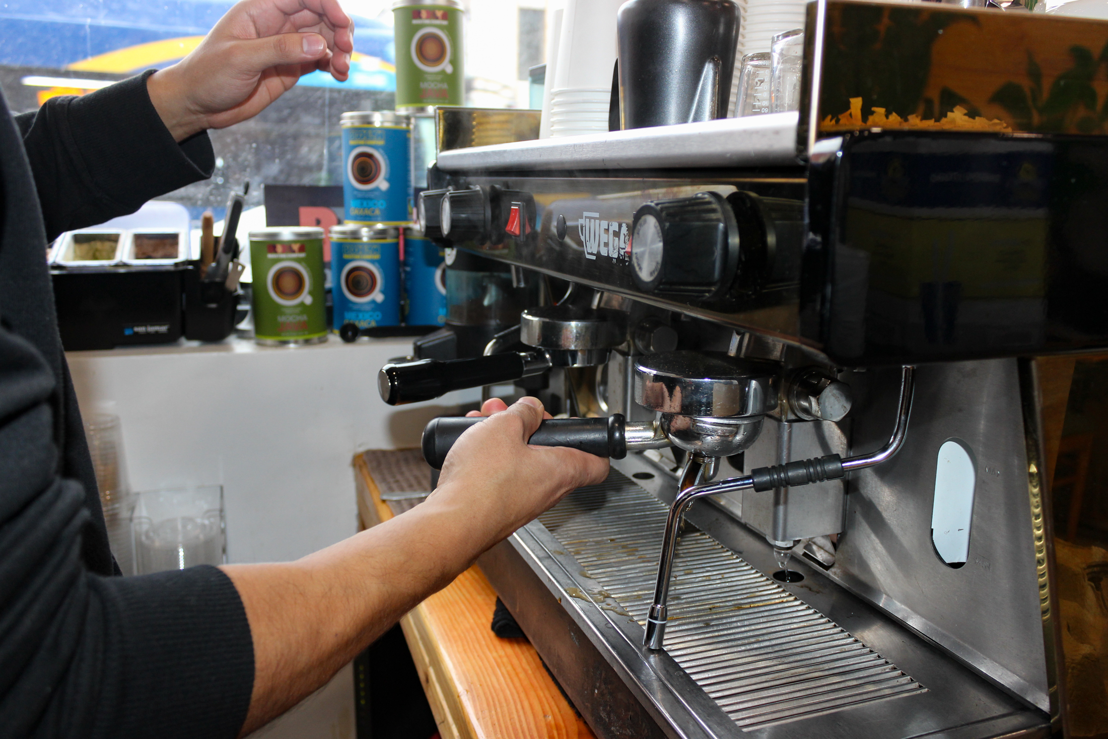 person making coffee