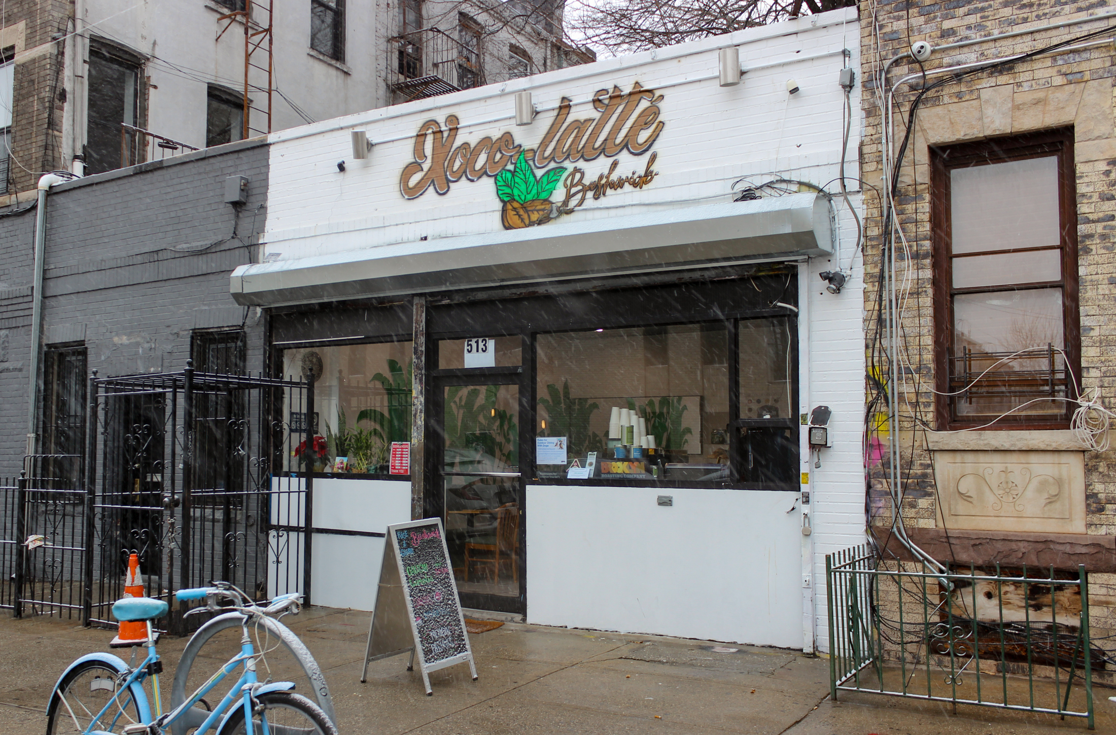 bushwick - white painted exterior of xoco latte