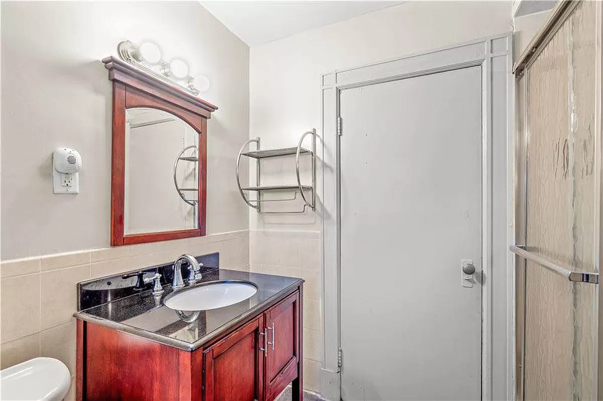 bathroom with wood vanity