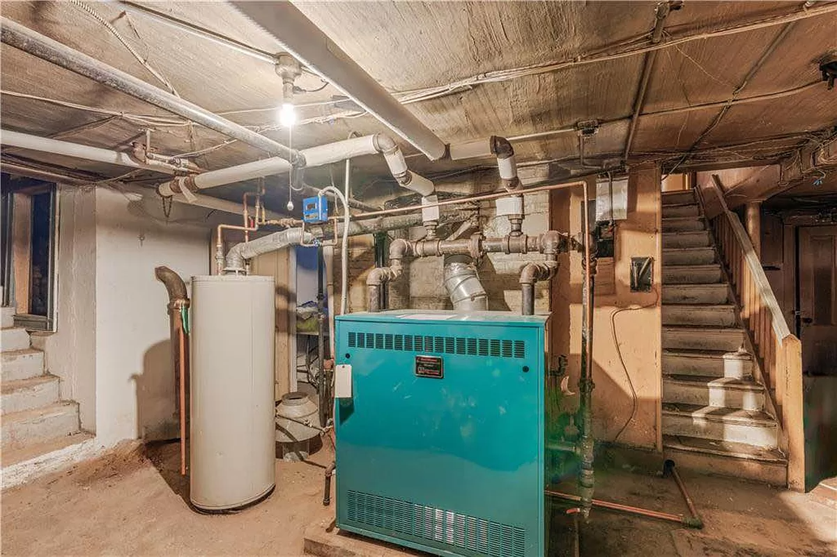 cellar with boiler and hot water heater