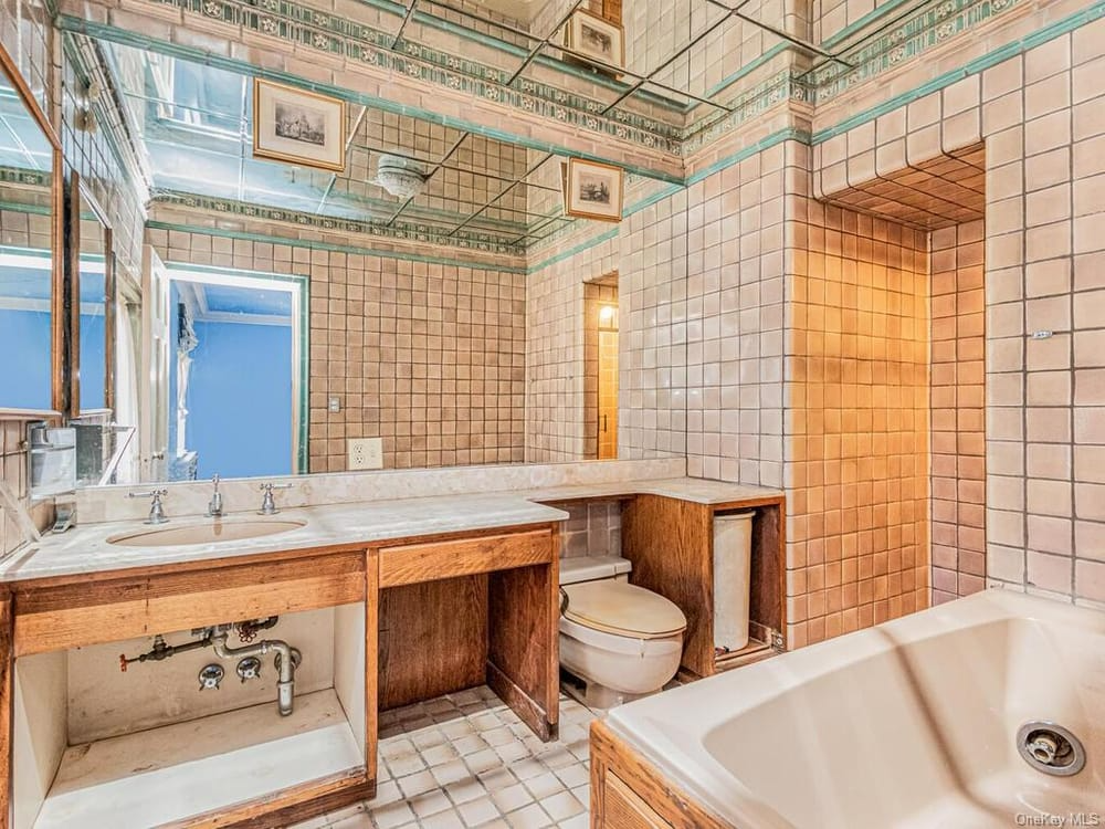 bathroom with art deco tiles and later cabinetry