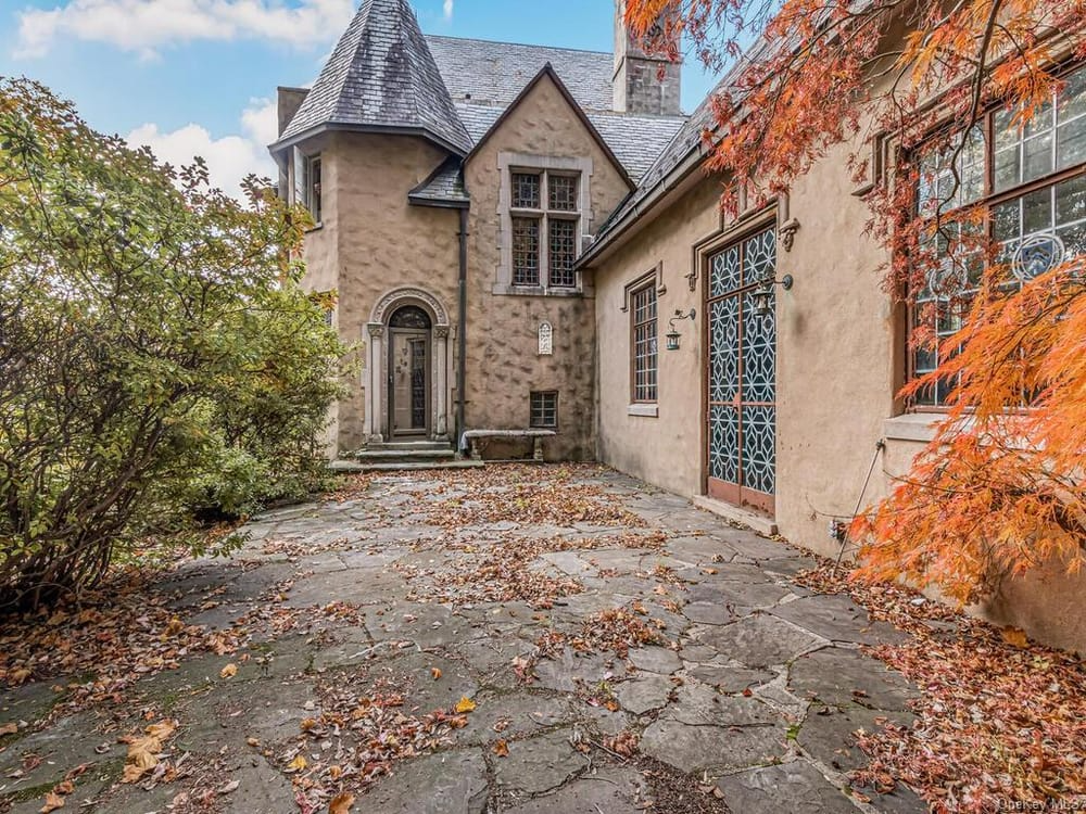 view of rear terrace with doors into living room