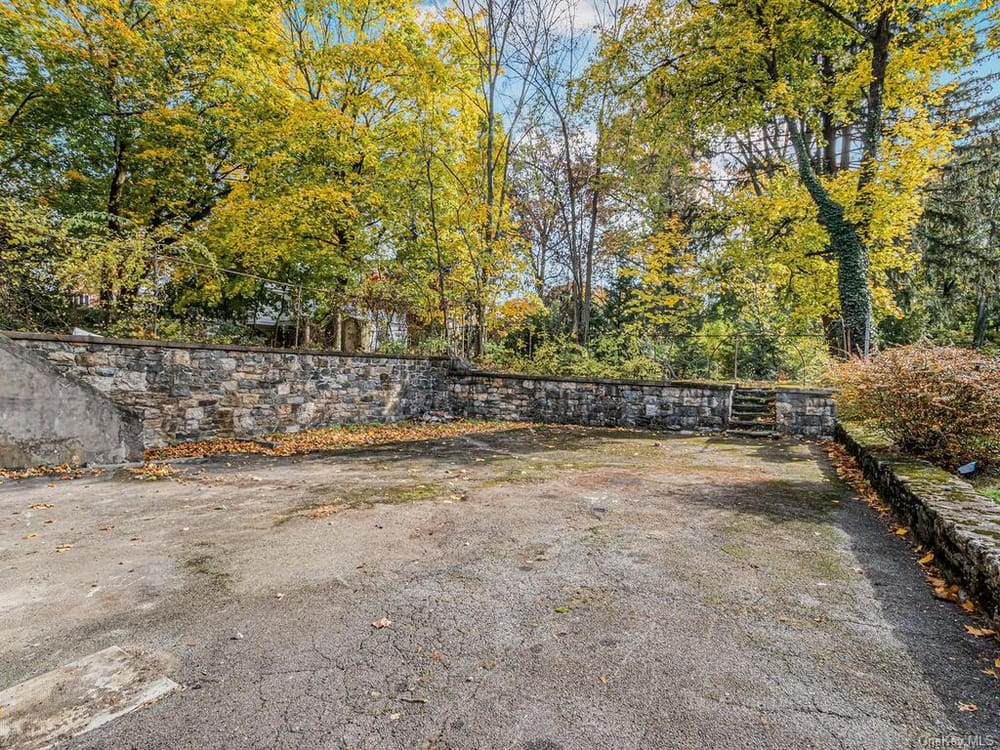 ivew of service court with steps up to garden