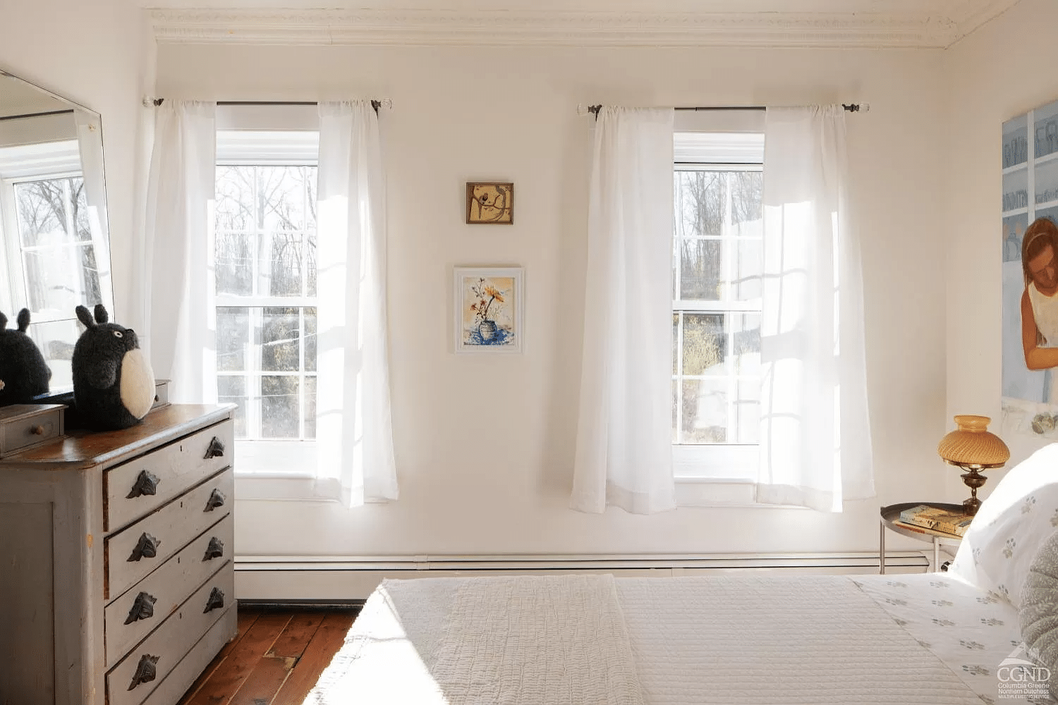 bedroom with two windows, baseboard heating