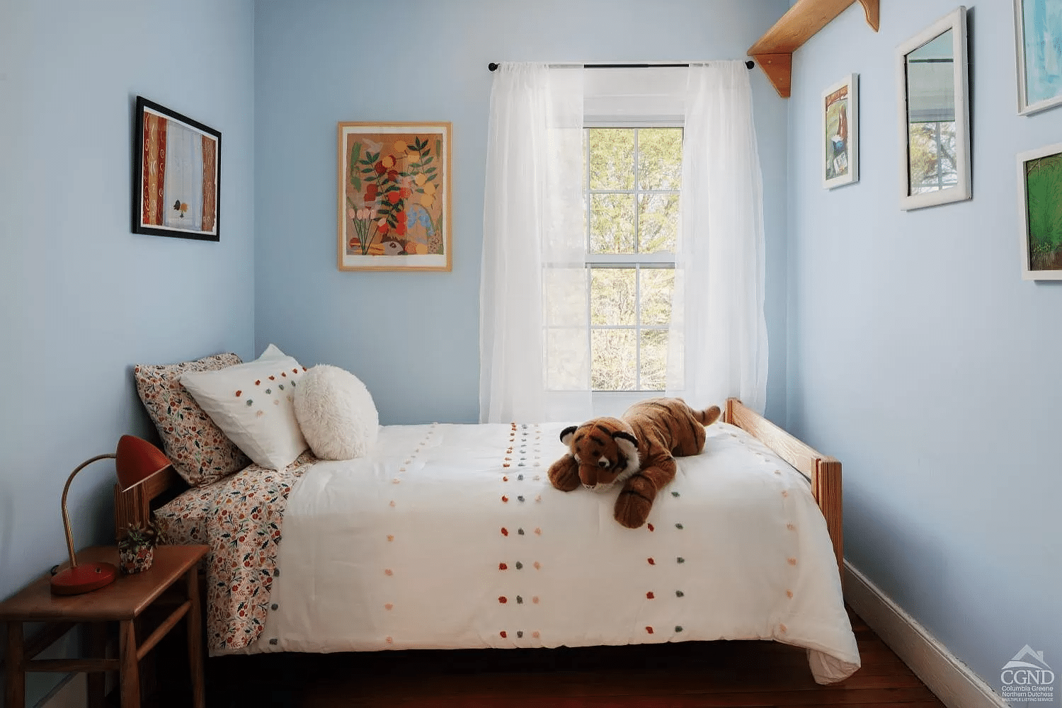 bedroom with blue walls, one window