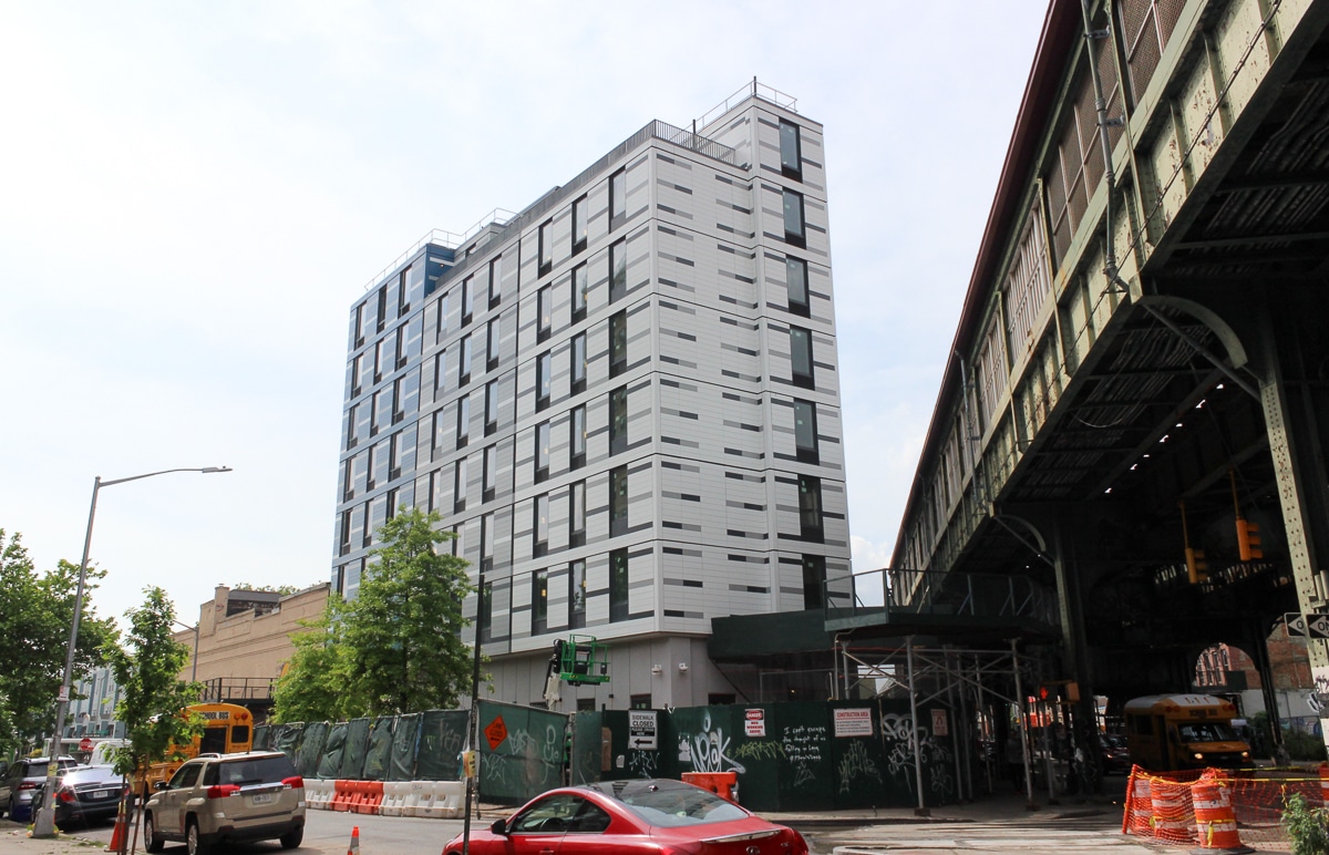 view of the building next to the elevated tracks