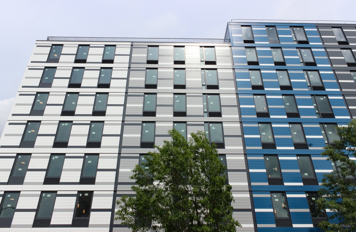 the facade with blue, gray and cream facades