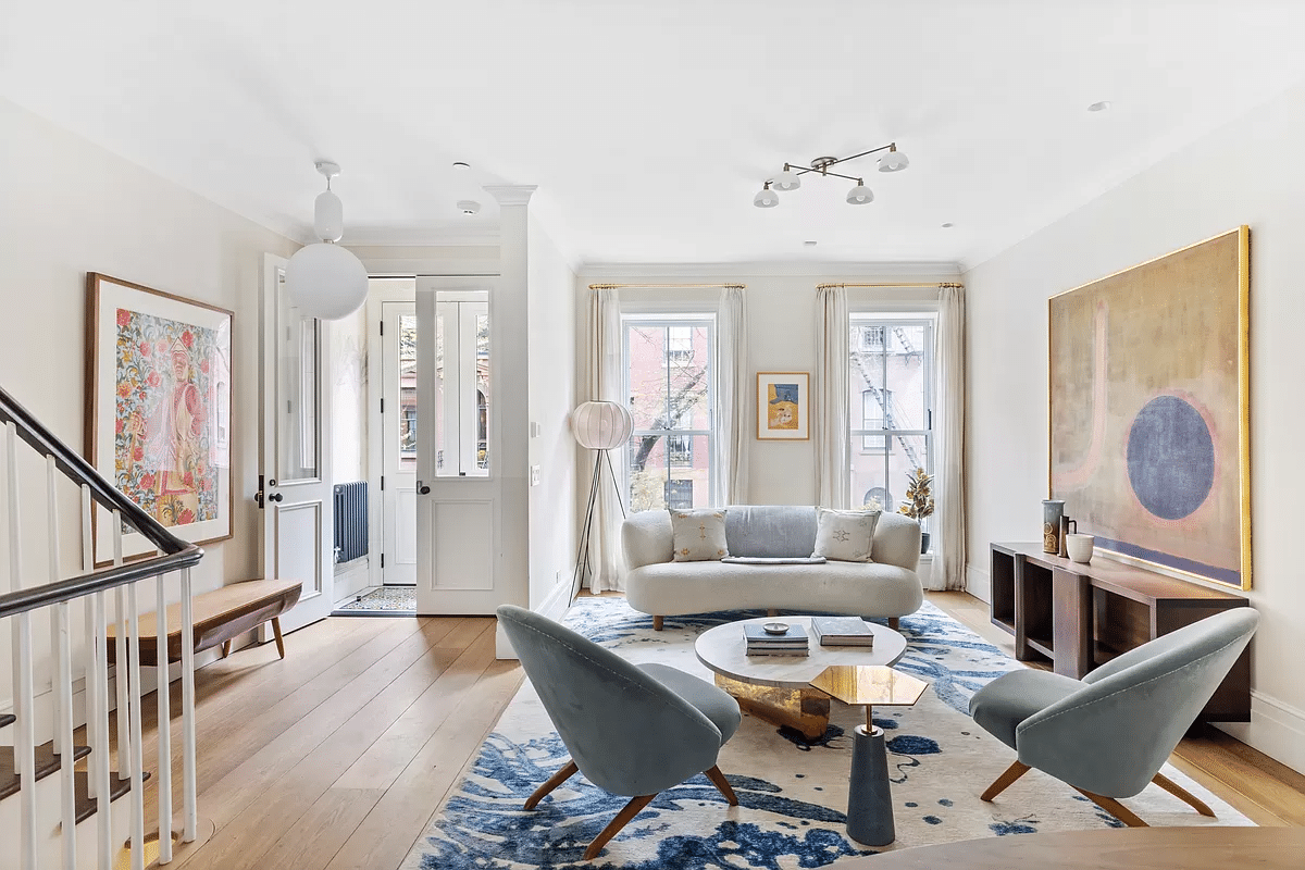 brooklyn heights - parlor with pale wood floors, white walls and view of entry
