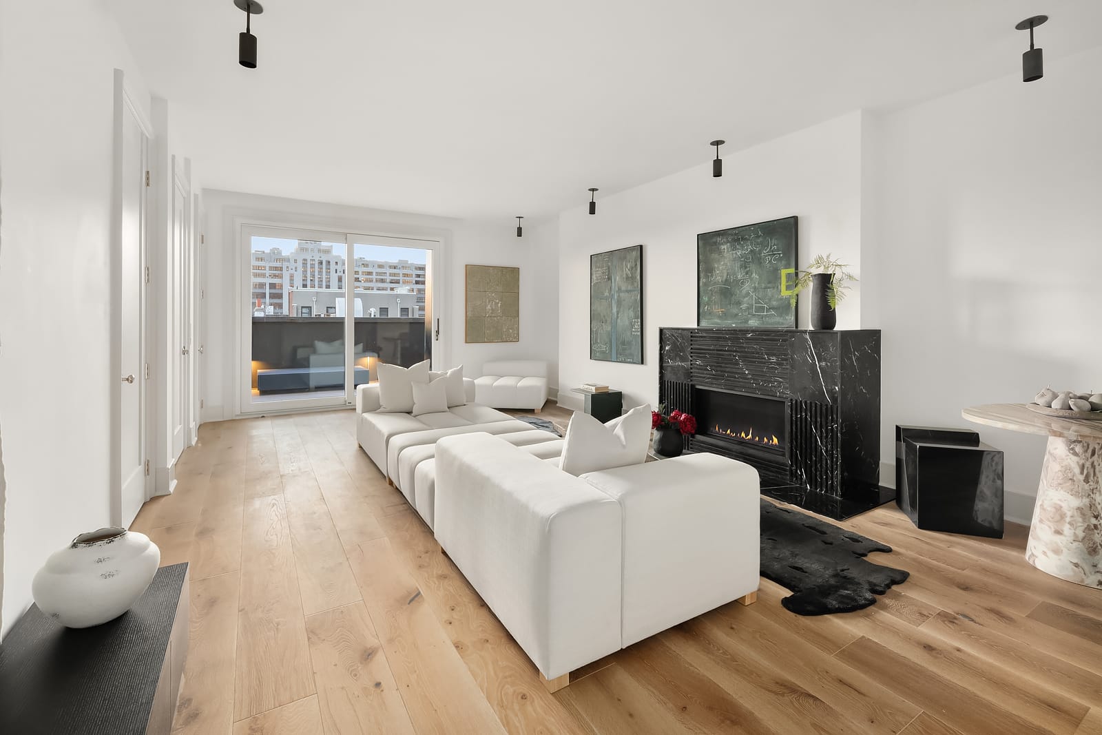 living room with mantel, doors to terrace