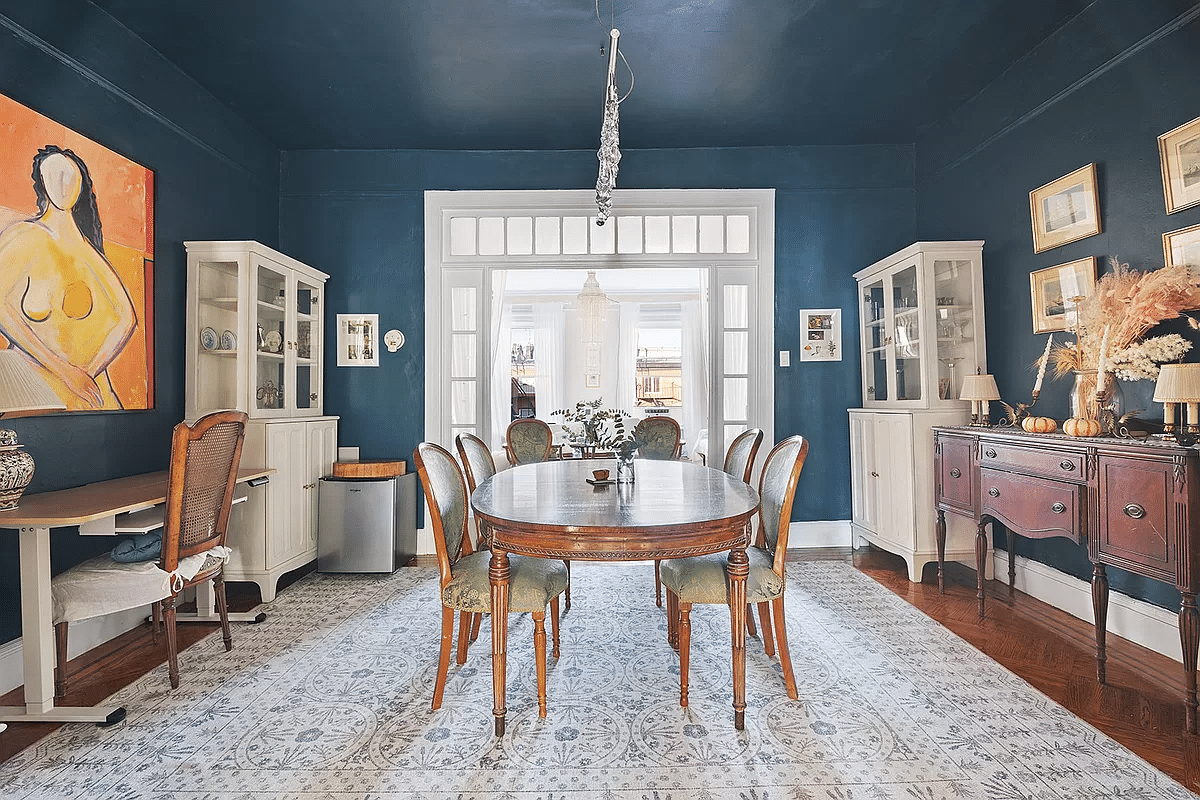 dining room with dark blue walls