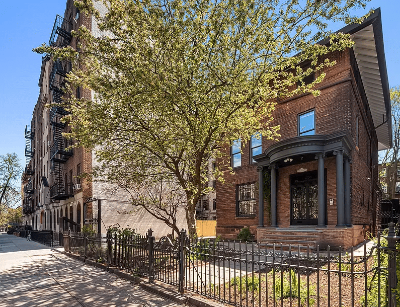 crown heights - brick standalone with iron fence around the yard